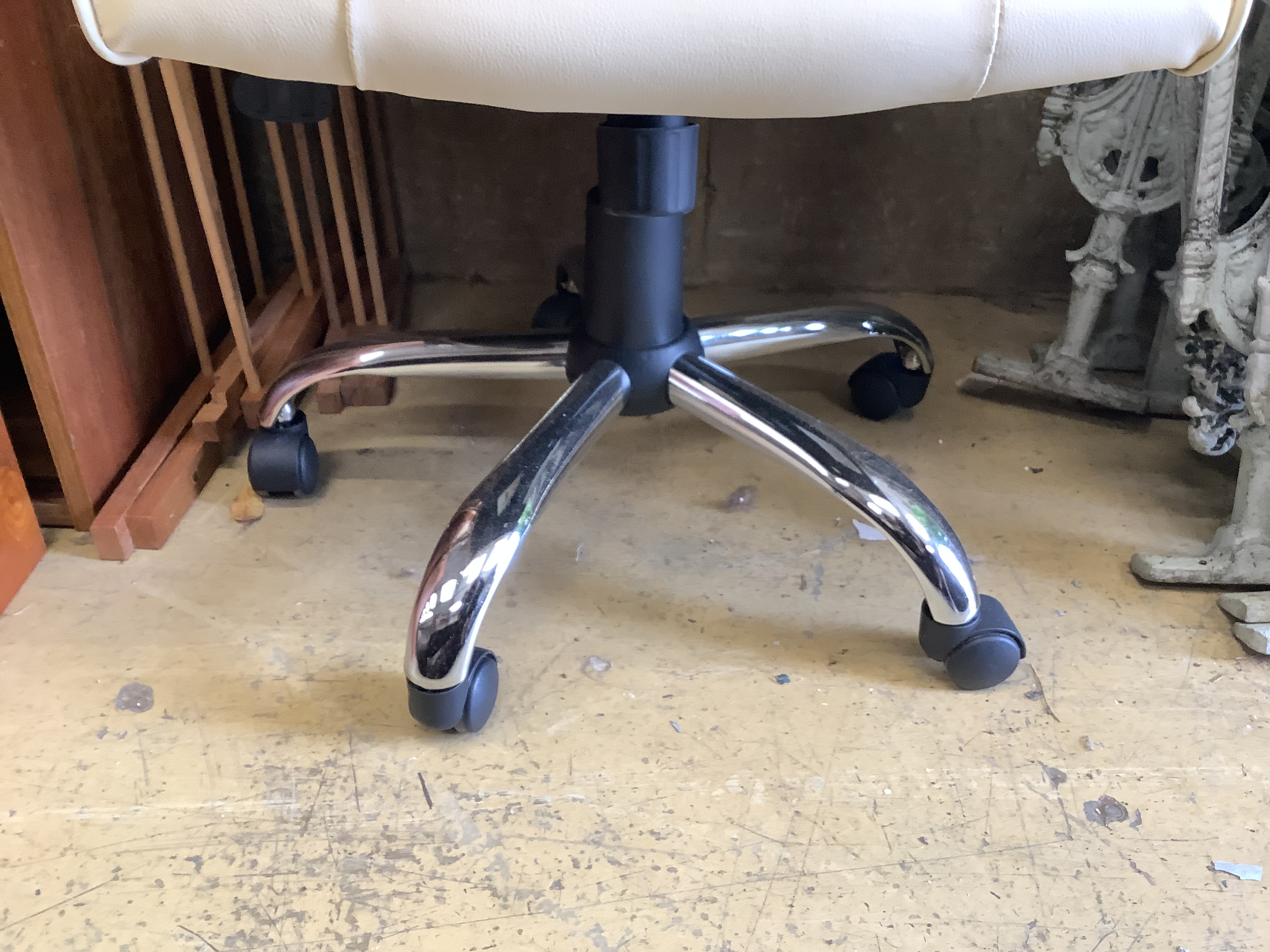 A modern white leather and chrome swivel desk armchair, width 63cm, height 106cm